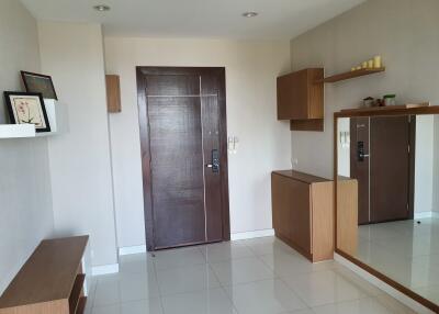 Entrance area with modern wooden door and minimalist decor