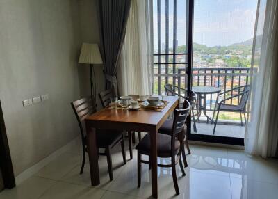 Dining area with table set and balcony view