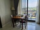 Dining area with table set and balcony view