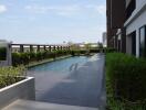 Outdoor swimming pool area with surrounding greenery