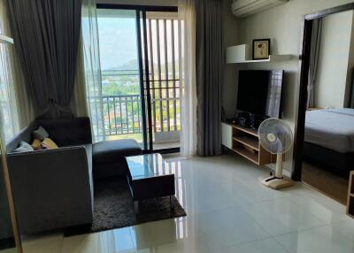 Modern living room with large window and balcony view