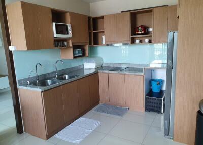 Modern kitchen with wooden cabinets and appliances