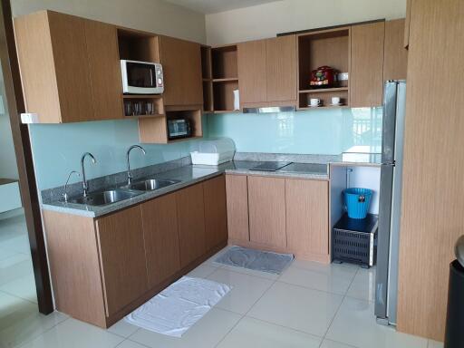 Modern kitchen with wooden cabinets and appliances