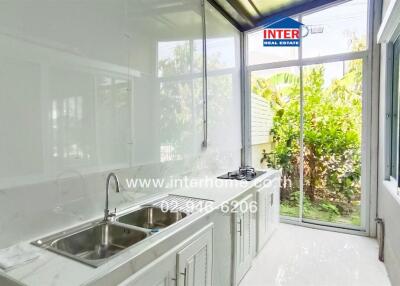 Spacious and modern kitchen with large windows