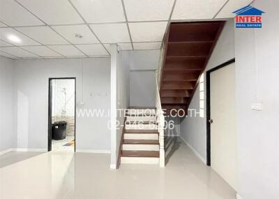 Stairs leading to upper floor in a minimalistic room