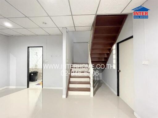 Stairs leading to upper floor in a minimalistic room