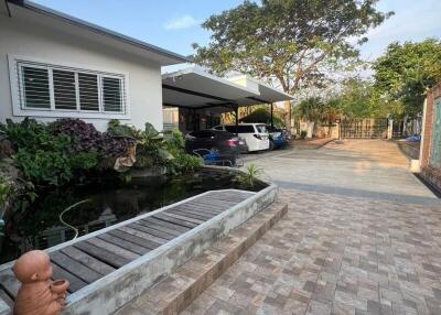 Exterior view of a home with a carport and garden