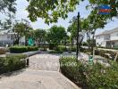 Outdoor community garden with exercise equipment and walking paths