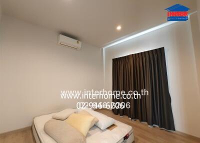 Bedroom with bed and air conditioner