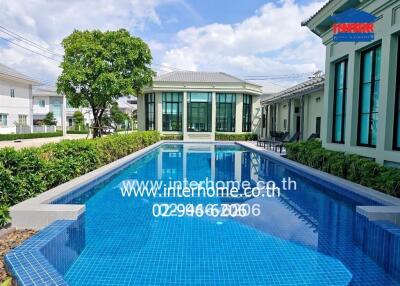 Outdoor swimming pool with modern building