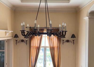 Elegant living room with chandelier and large windows