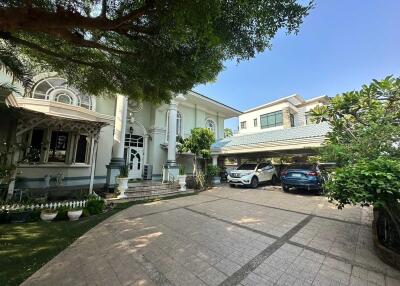 Spacious residential home exterior with driveway and garage