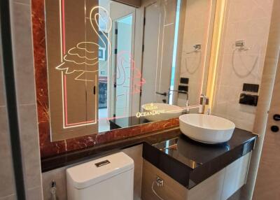 Modern bathroom with illuminated mirror and stylish basin