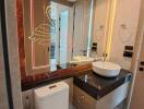 Modern bathroom with illuminated mirror and stylish basin