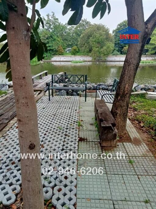 Outdoor seating area beside a river