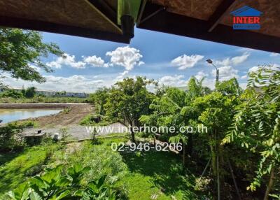 View from the property showing a green garden and surrounding area