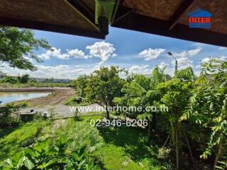 View from the property showing a green garden and surrounding area