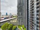 View of modern high-rise buildings with greenery and cityscape