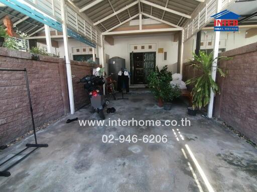 Property entrance with covered porch