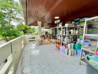 Outdoor storage area with shelves and boxes