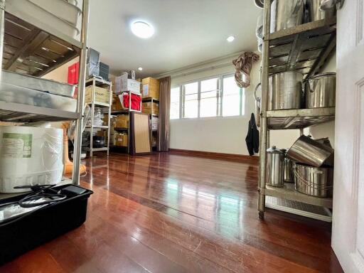 Organized storage room with wooden flooring