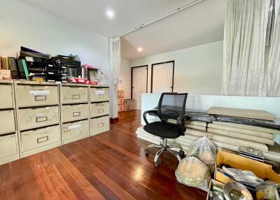 Home office with filing cabinets and office chair
