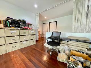 Home office with filing cabinets and office chair