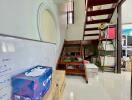 Storage area under a staircase with whiteboard and boxes