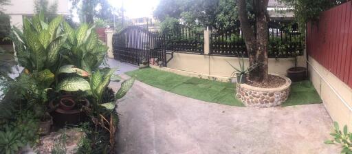 Front yard with a gated entrance