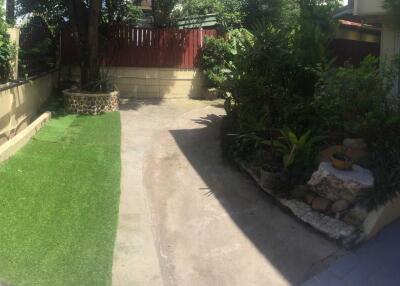 Outdoor area with garden and driveway