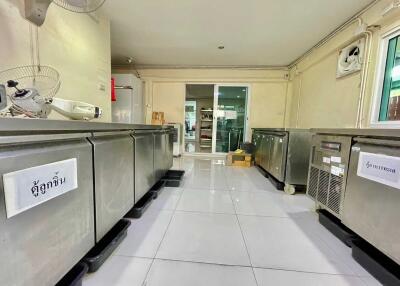 Commercial kitchen area with stainless steel appliances
