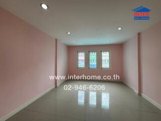 unfurnished room with pink walls and tile floor