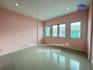 Bedroom with large windows and pink walls