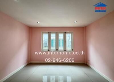 Empty room with pink walls and a window, suitable for various purposes