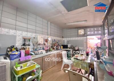 A well-equipped and organized kitchen area with various appliances and utensils.