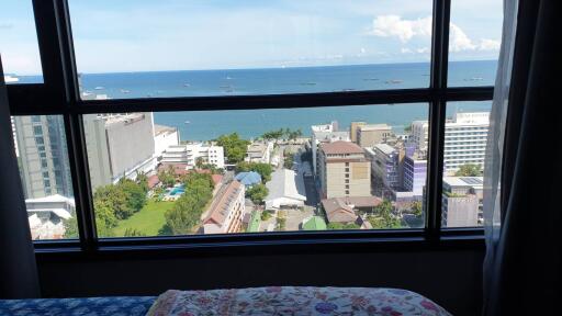 Bedroom with a view overlooking the city and ocean