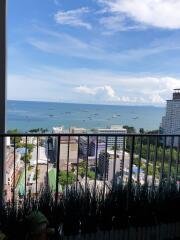 Balcony with a view of the city buildings and the ocean