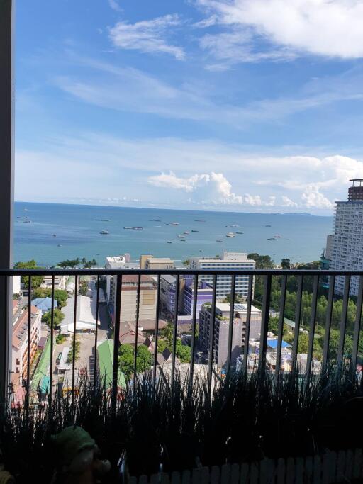 Balcony with a view of the city buildings and the ocean