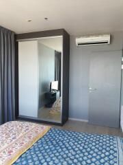 Bedroom with mirrored wardrobe and air conditioning