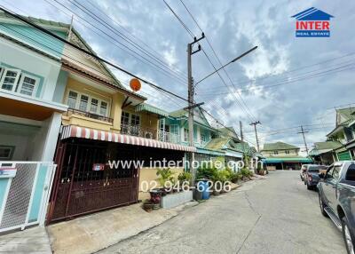 Street view of a residential neighborhood with houses