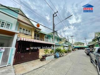 Street view of a residential neighborhood with houses