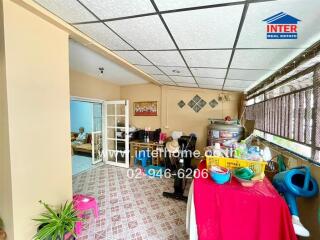 Indoor common area with various items and furniture