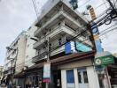 Street view of a multi-story apartment building