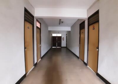 Hallway with several closed doors