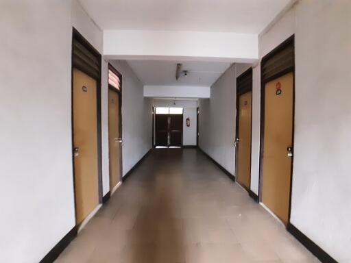 Hallway with several closed doors