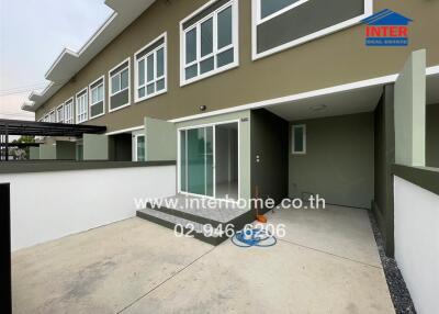 Modern townhouse exterior with spacious driveway