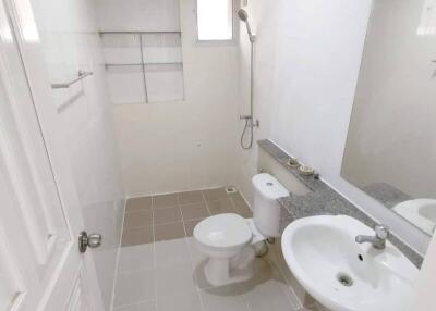 Modern bathroom with sink, toilet, and shower