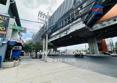 Street view showcasing main road and nearby infrastructure