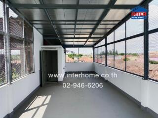 Covered balcony area with metal roofing