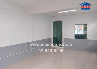 empty room with tiled floor and white-gray paint